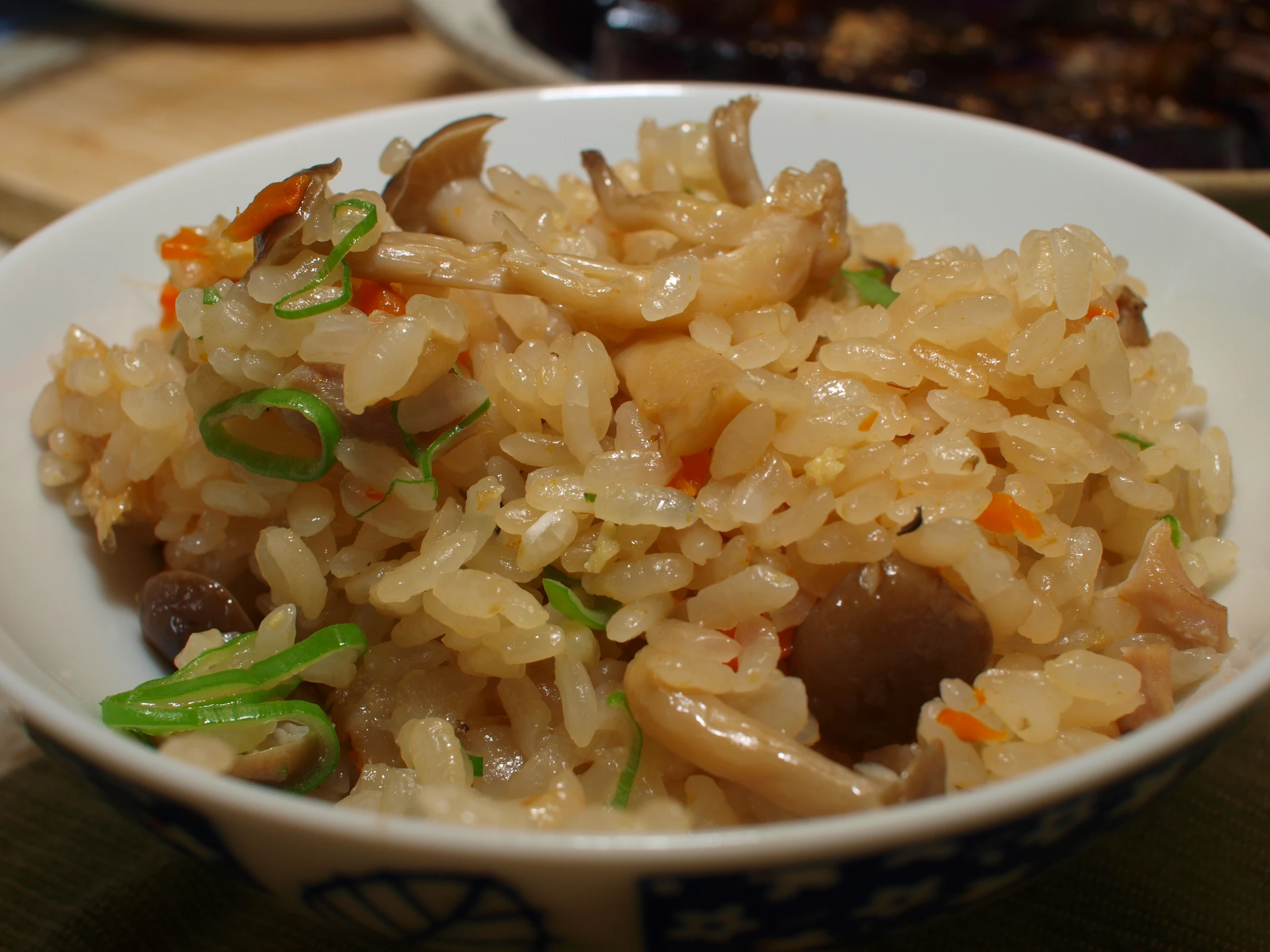 there are a small bowl with rice and mushrooms in it