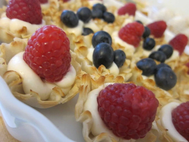 some fruit is laying on top of some waffles