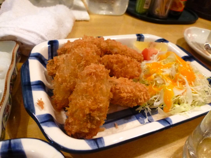 a tray with fried food on top of it