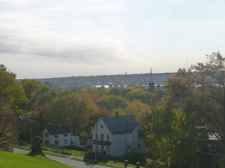 some houses and trees are seen in the distance