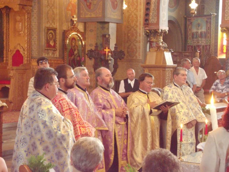 a group of people wearing religious clothing in a church