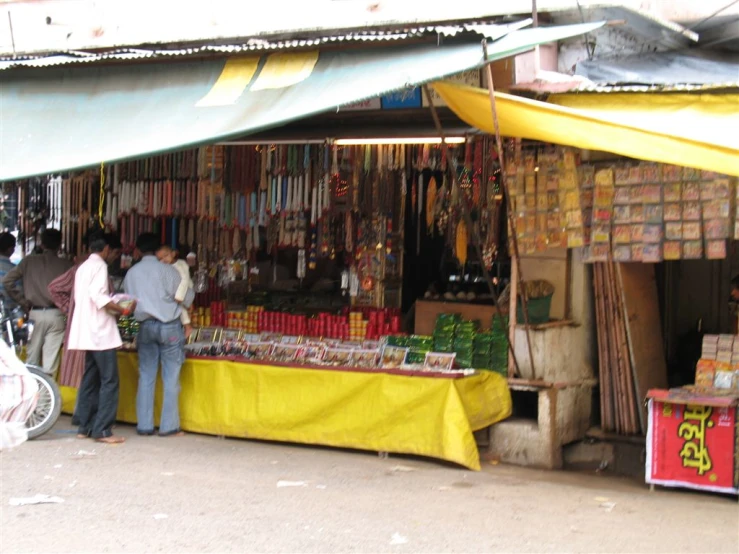 a group of people standing outside of a store