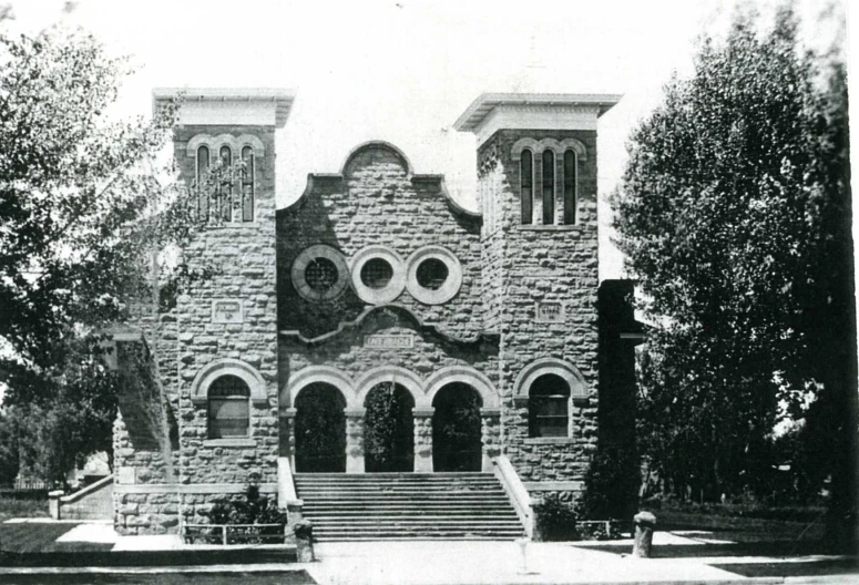 a black and white image of an old church