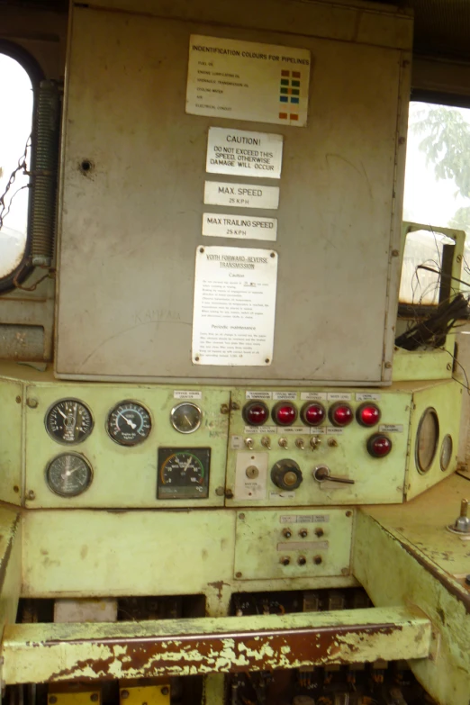 dashboard with several instruments and gauges displayed in front of window