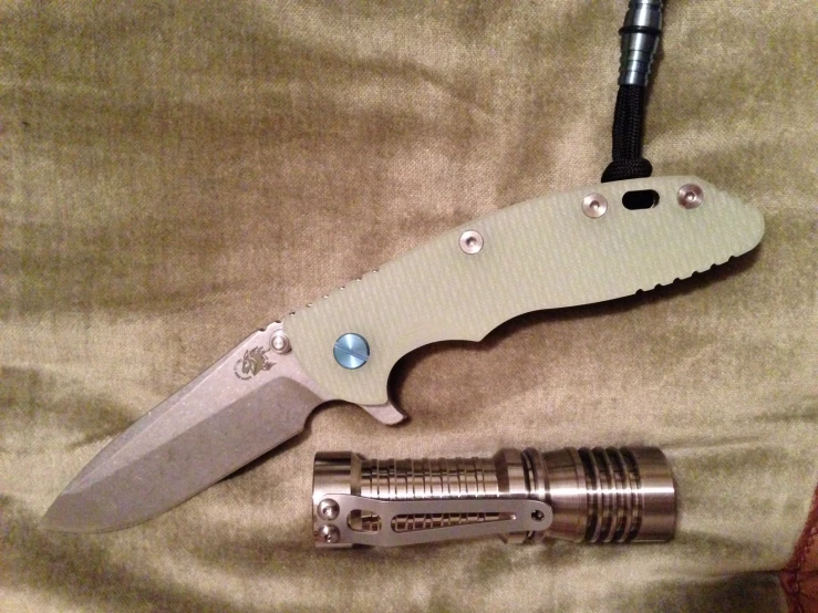 the new folding knife is resting next to the tool
