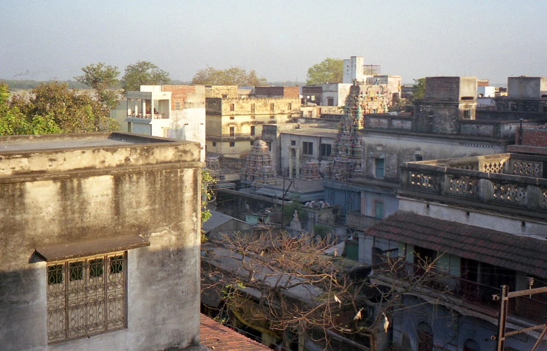 buildings with trees on top of them in the distance