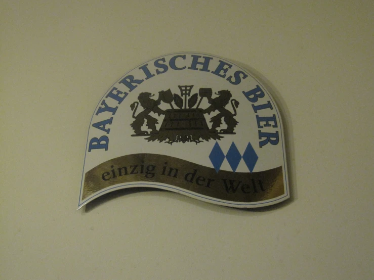 an emblem with a banner for the river reiches beer company