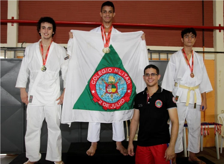 several young people stand around with white robes