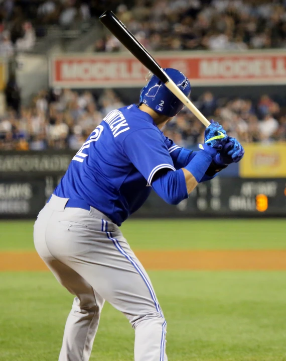 a baseball player holding a bat during a game