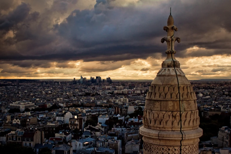 a city skyline has dark clouds with clouds over it