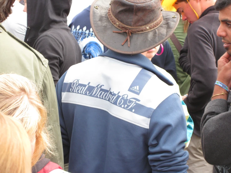 a person wearing a hat at a fair