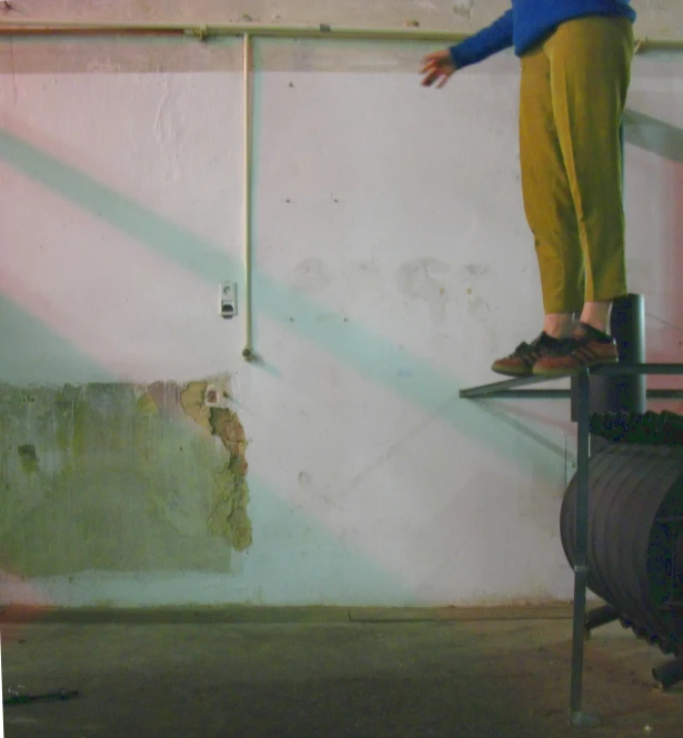 a person on a skateboard jumping over a luggage rack