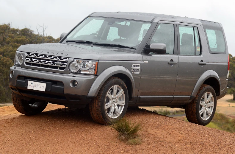 an image of a range rover on dirt road
