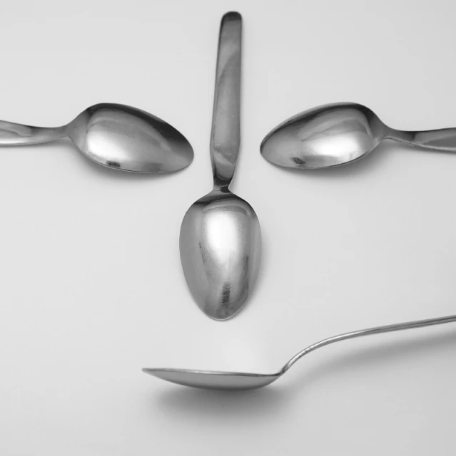 spoons with spoon rest in a flattered position