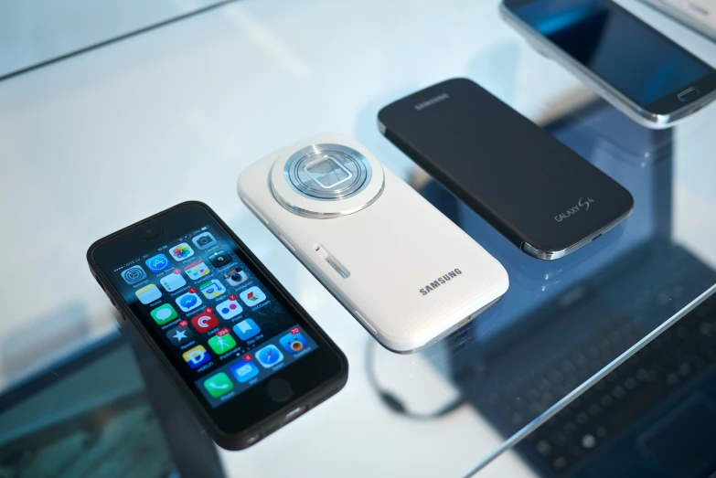 an array of cellphones sitting on a counter