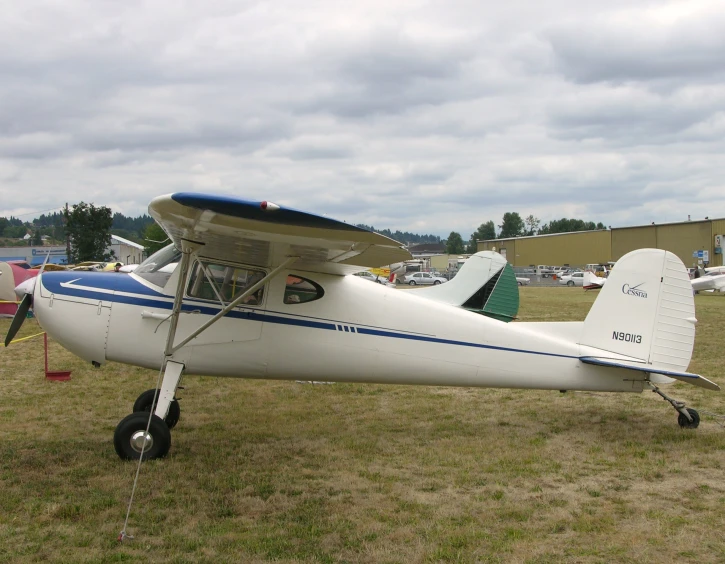 a small airplane sitting on top of an airfield