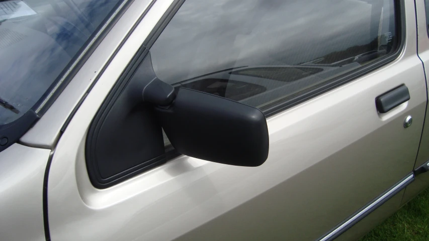 a side view mirror on the outside of a vehicle