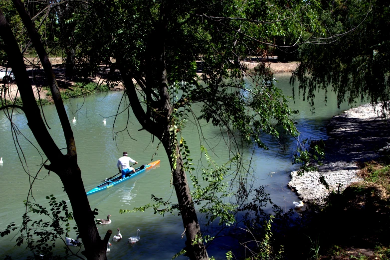 two people are on a canoe in a river