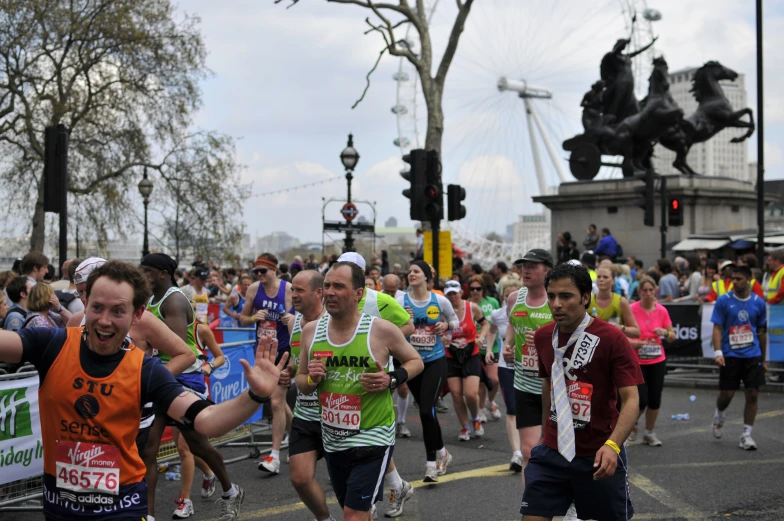 marathon runners are in formation with each other