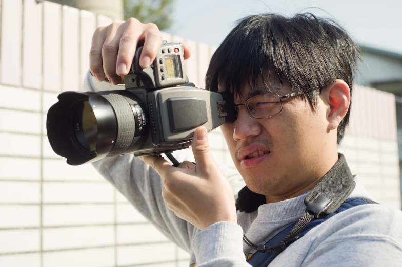 a man taking a po of himself with his camera