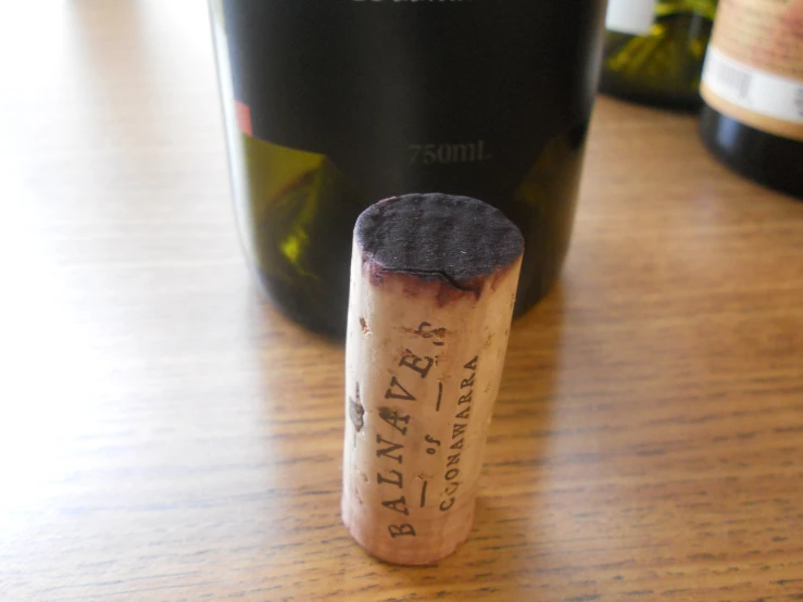 a closeup s of the corks on a wine bottle