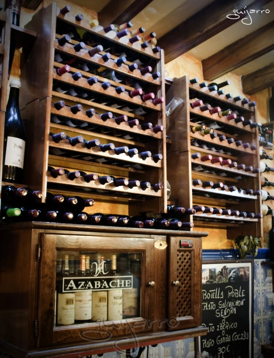 a number of wine bottles on a shelf