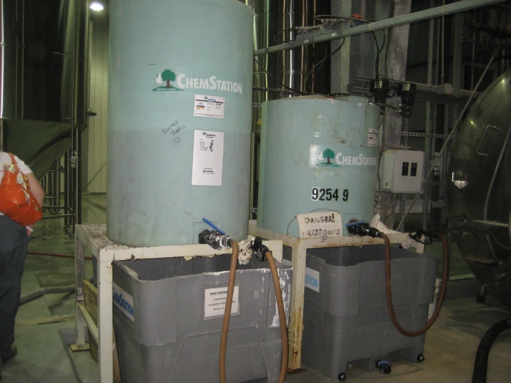 a couple of tanks on a small stand in a room