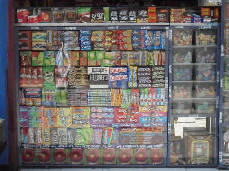 a large amount of snacks is stacked in a store front