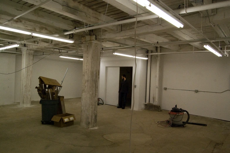 an empty room with various items on the floor