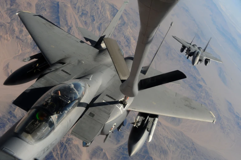 a close up view of a fighter jet in the air