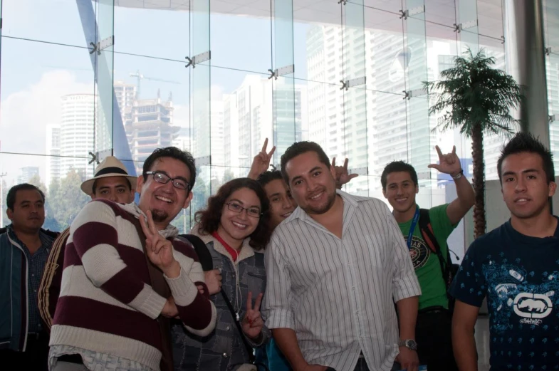 a group of people are posing for the camera