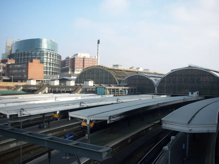 a train station with some trains in it