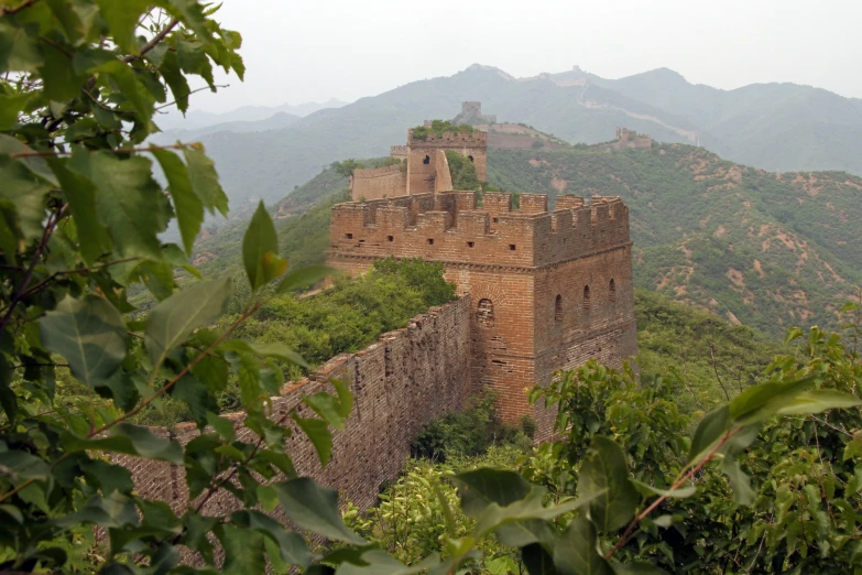 an old castle built on top of a mountain