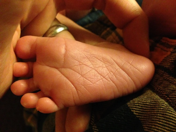 the top end of a person's foot and fingers