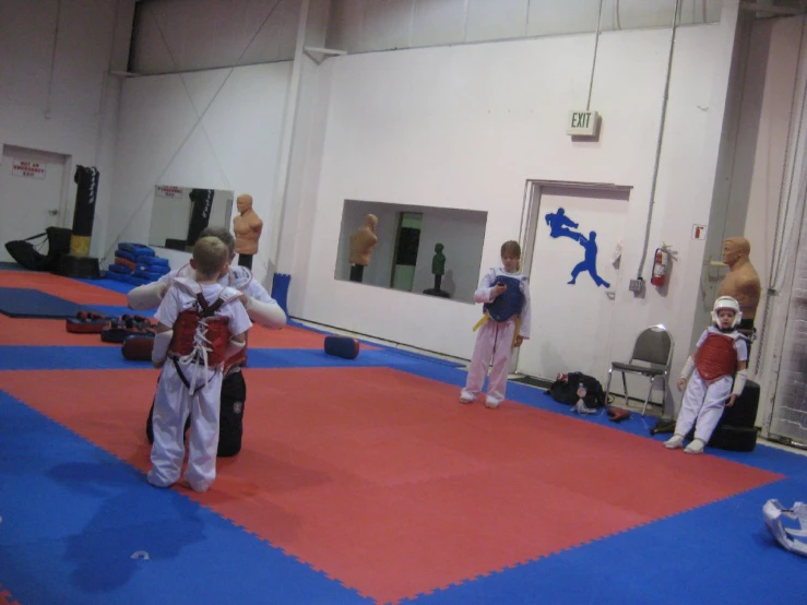 karate players training inside of an indoor gym