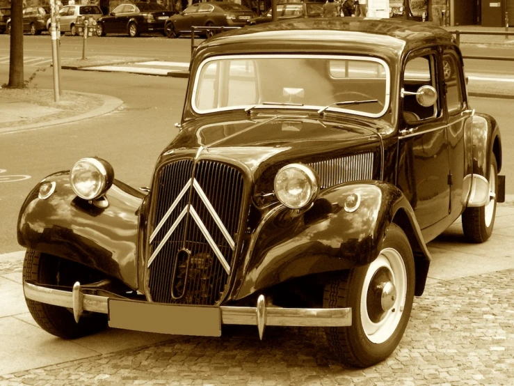 an old fashion car parked in a parking lot
