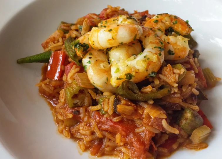 a bowl with rice and shrimp on it