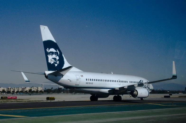 a large jumbo jet plane that is on the runway