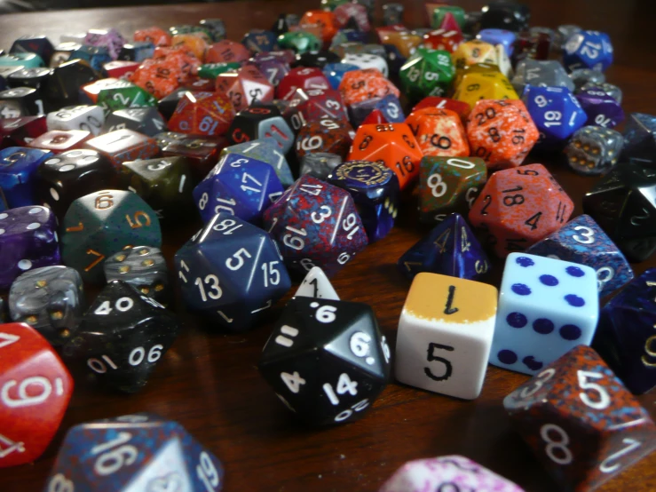 a group of dice on a table all with numbers