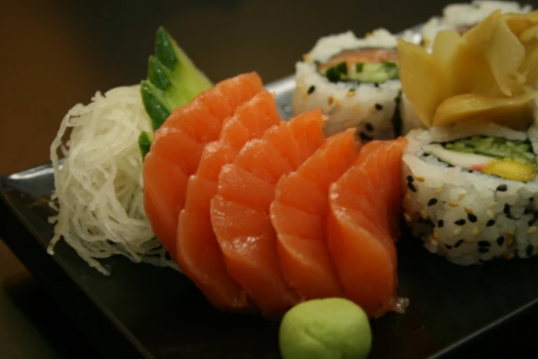 a close up of several sushi and an open faced