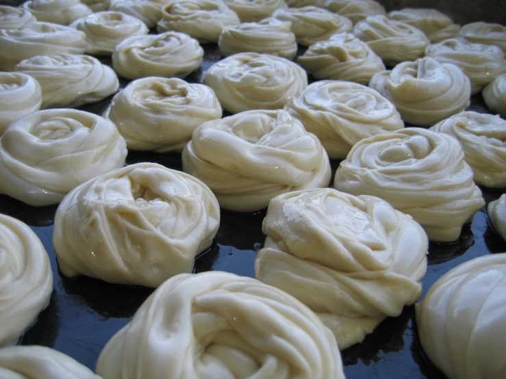 a baking pan filled with rolled up cakes