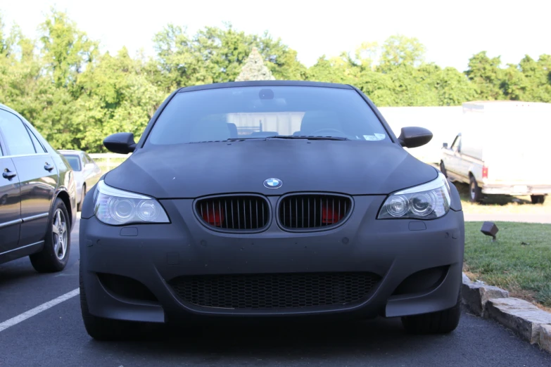 two cars are parked on the side of a road