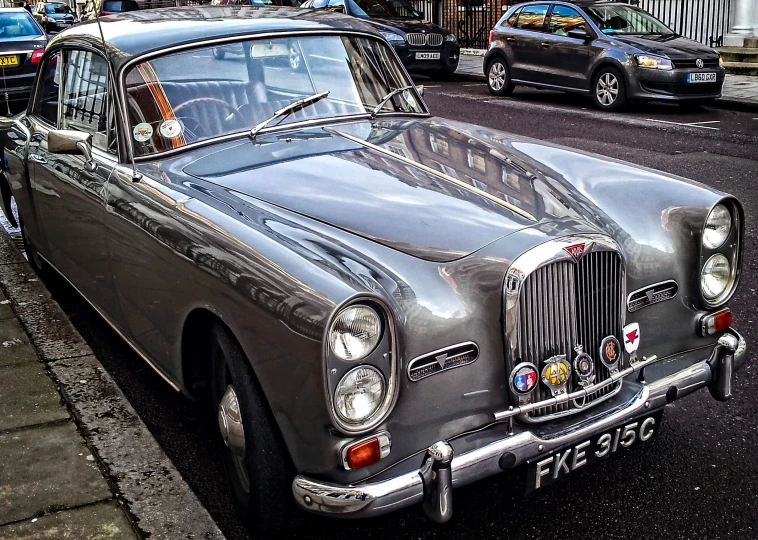 old fashion car parked on the street near a curb