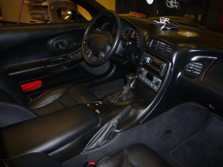 an interior view of a sporty car and dashboard