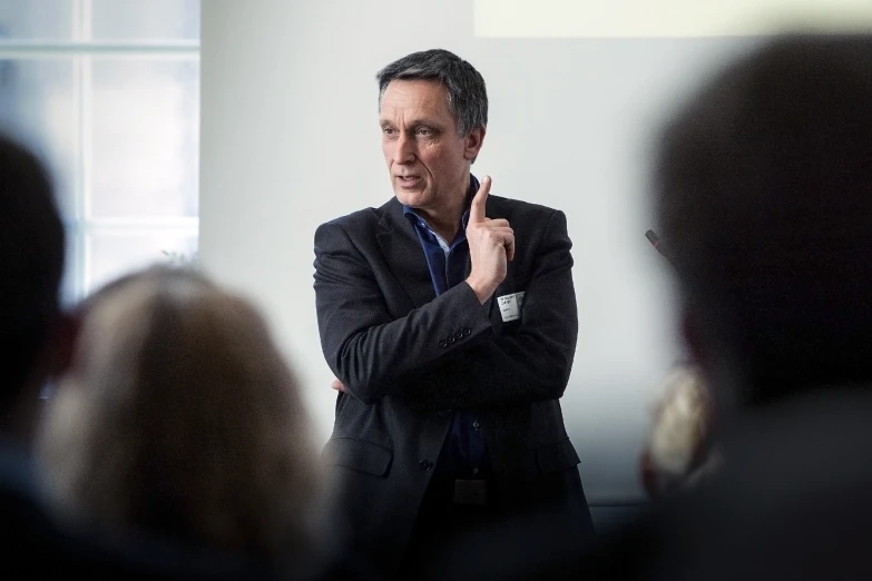 man giving a presentation to a group of people