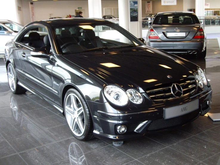 an image of a mercedes benz coupe car in a showroom