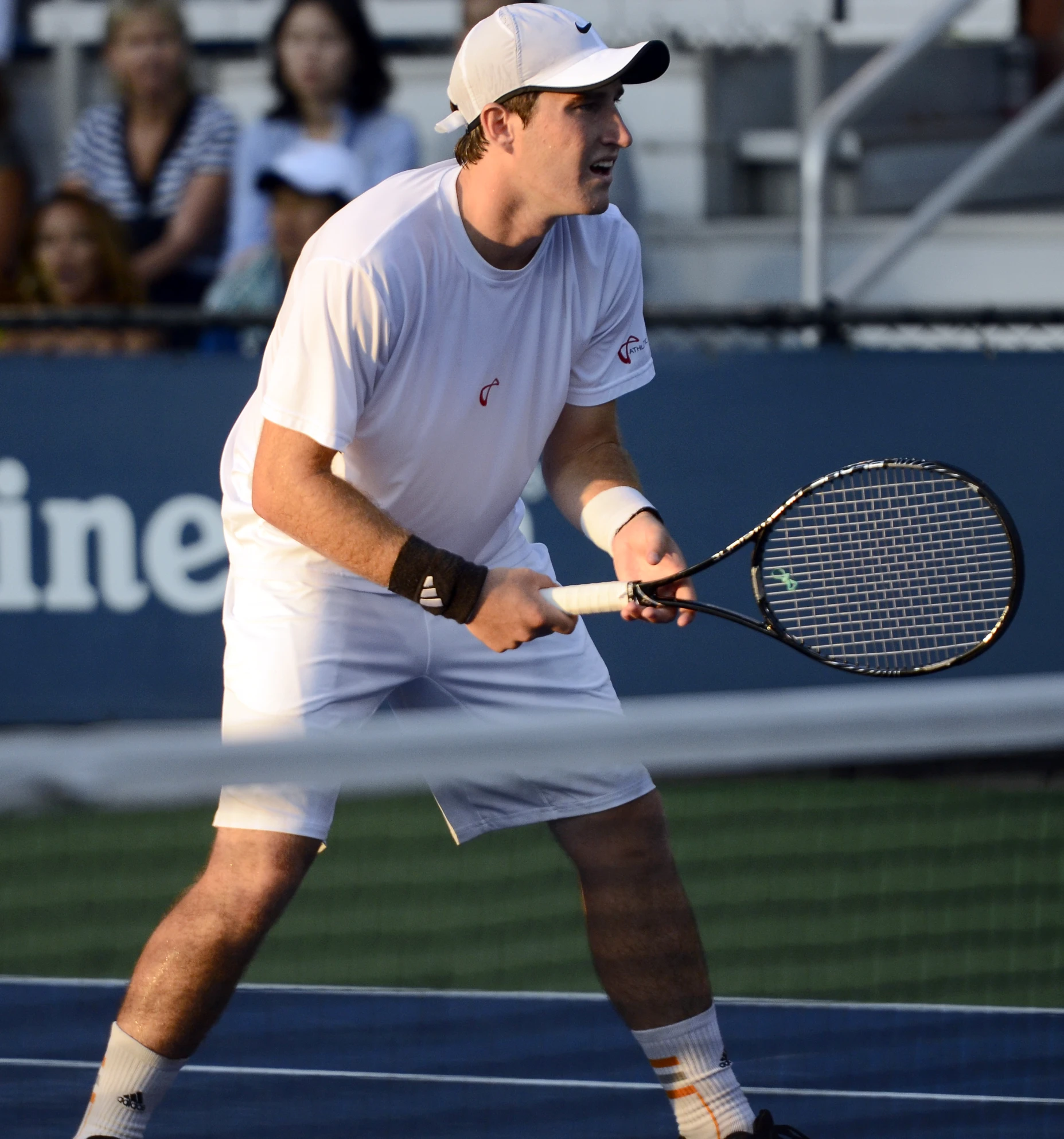 a man on a court with a racket