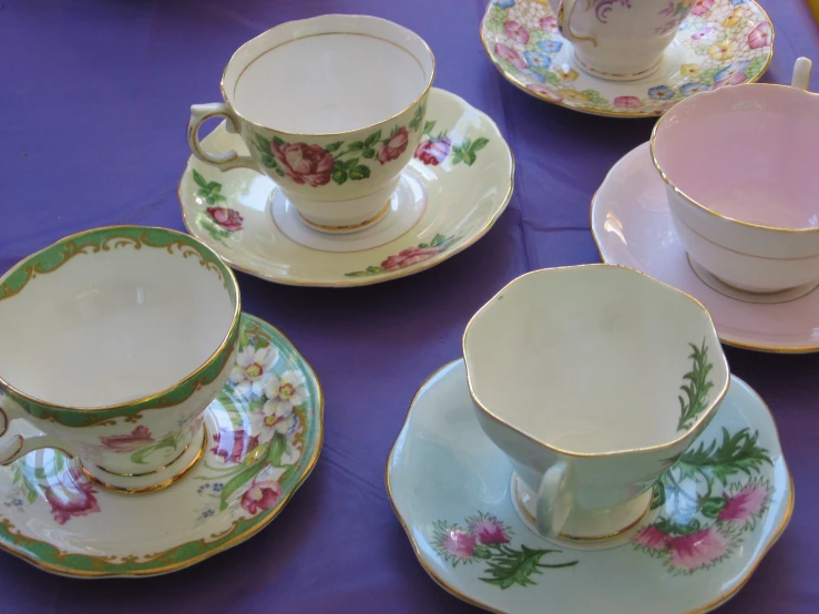 six tea cups and saucers with matching saucers