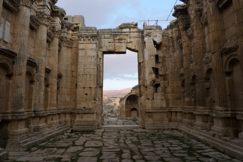 a po looking inside of a temple with the view of the ruins