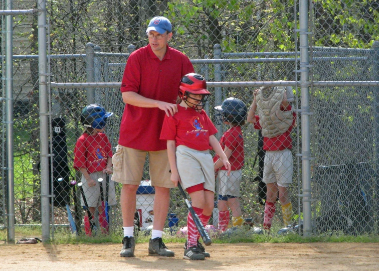 a man holding a  next to a catcher